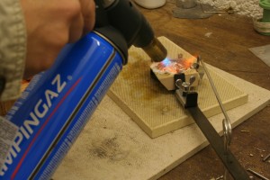 heating the silver in the crucible